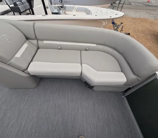 Slide: The Image of The image shows a gray upholstered seating area on a boat. - 22