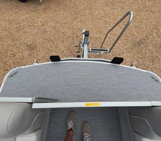 Slide: The Image of Top view of a boat deck with gray carpeting and a trailer hitch. - 24