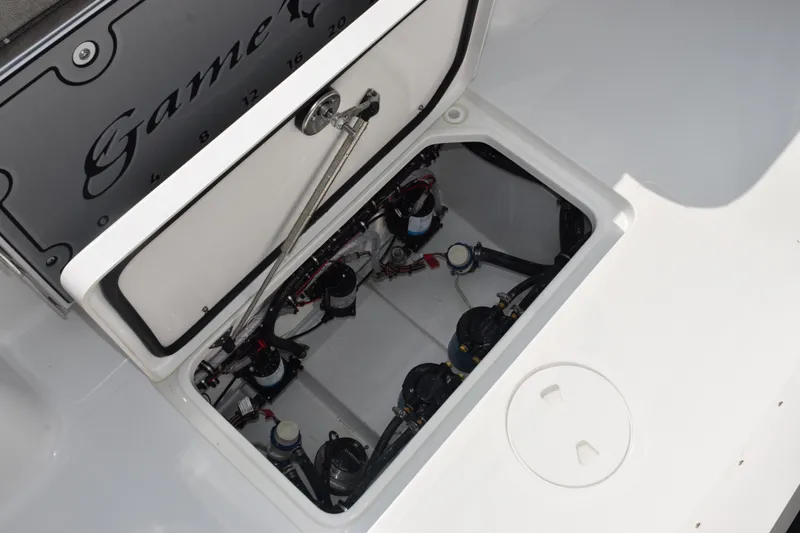 Slide: The Image of 2026 Sea Hunt Gamefish 28 Coffin Box open, revealing internal components and storage space. - 18