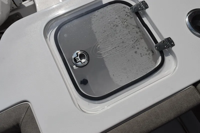 Slide: The Image of Hatch cover on 2026 Sea Hunt Gamefish 28 Coffin Box boat, featuring secure latch and hinges. - 19