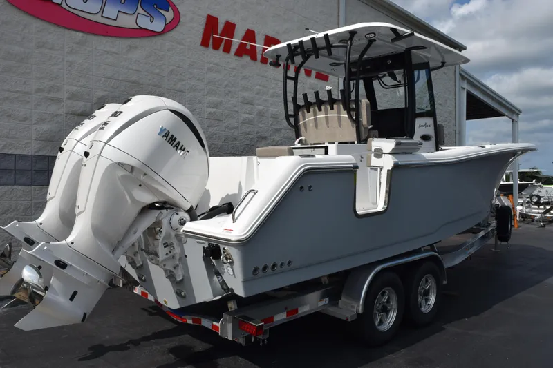 Slide: The Image of 2026 Sea Hunt Gamefish 28 Coffin Box boat with Yamaha engines on a trailer. - 4