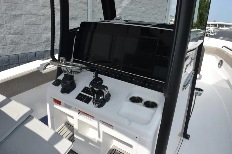 Slide: The Image of 2026 Sea Hunt Gamefish 28 Coffin Box boat console with modern controls and displays. - 9