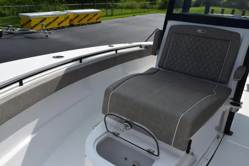 Slide: The Image of 2026 Sea Hunt Gamefish 28 Coffin Box boat interior with cushioned seating and storage. - 13