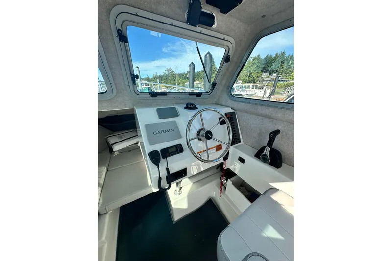 Slide: The Image of Interior of a 2022 Parker 2120 Sport Cabin boat with Garmin navigation system. - 23