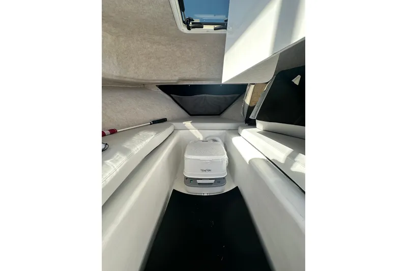 Slide: The Image of Interior of 2022 Parker 2120 Sport Cabin, featuring seating and storage space. - 28