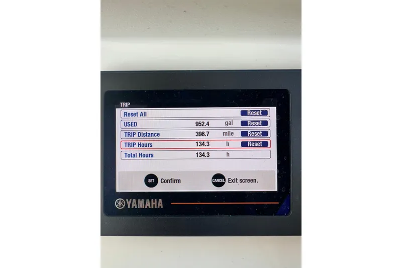 Slide: The Image of Yamaha display showing trip data: 398.7 miles, 134.3 hours, 962.4 gallons used. - 30