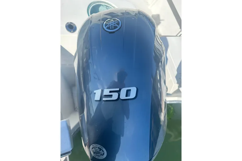 Slide: The Image of Outboard motor on 2022 Parker 2120 Sport Cabin boat, featuring 150 horsepower. - 31