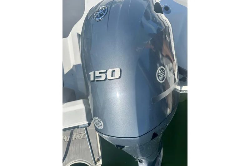 Slide: The Image of Yamaha 150 outboard motor on a 2022 Parker 2120 Sport Cabin boat. - 32