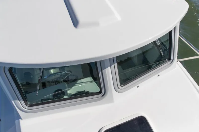Slide: The Image of Manufacturer Provided Image: Close-up of 2022 Parker 2120 Sport Cabin boat windows. - 37