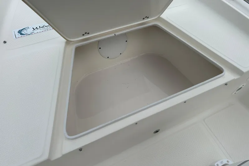 Slide: The Image of Open storage compartment on a 2016 Key West 1520 Center Console boat. - 12