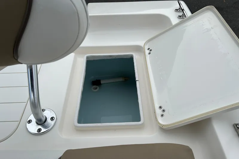 Slide: The Image of Open storage compartment on a 2016 Key West 1520 Center Console boat. - 16