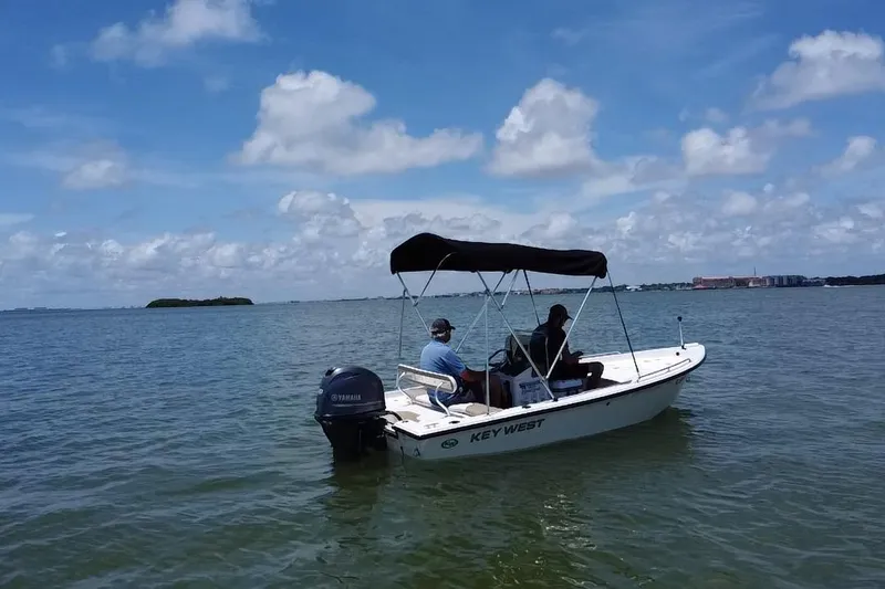 Slide: The Image of 2016 Key West 1520 Center Console boat on calm waters under a blue sky. - 19