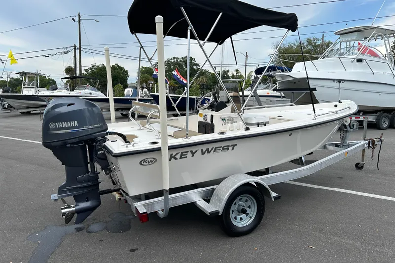 Slide: The Image of 2016 Key West 1520 Center Console boat with Yamaha outboard motor on trailer. - 2