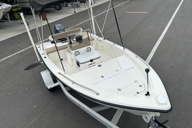 Slide: The Image of 2016 Key West 1520 Center Console boat on trailer, parked in a lot. - 6