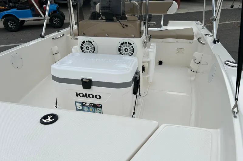 Slide: The Image of 2016 Key West 1520 Center Console boat interior with Igloo cooler and seating. - 9