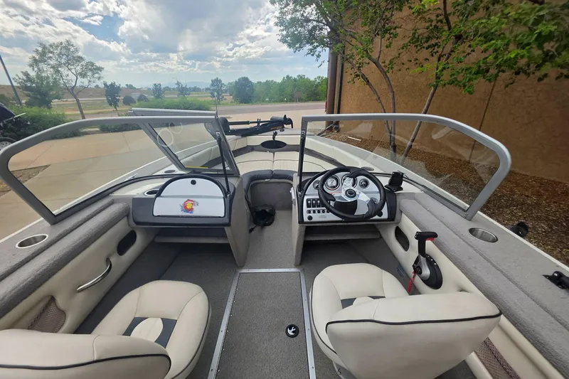 Slide: The Image of Interior of a 2010 Starcraft NexStar 1910 I/O boat with dual seating and steering console. - 1