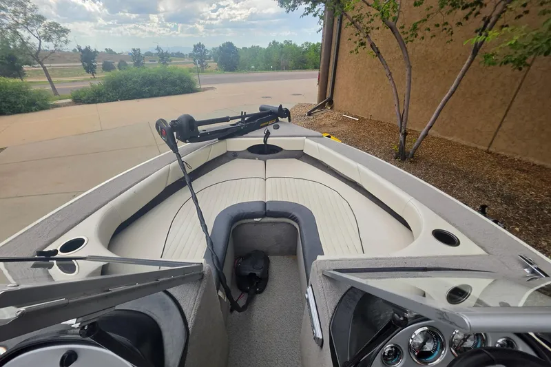 Slide: The Image of 2010 Starcraft NexStar 1910 I/O boat interior with seating and steering console. - 3