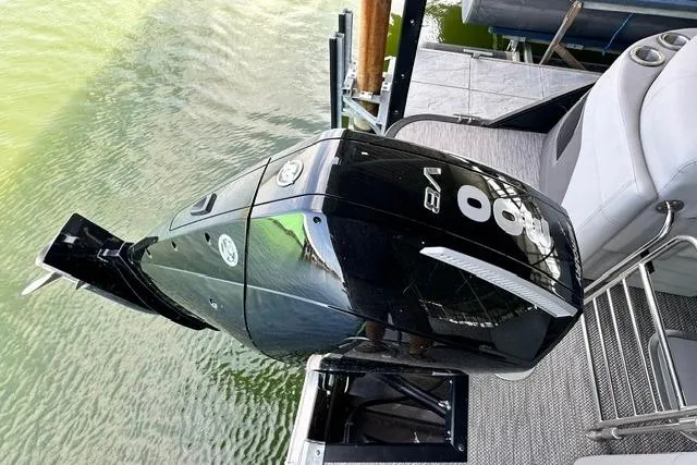 Slide: The Image of 2021 Bennington L Bowrider 25 Quad Bench with powerful V8 outboard motor. - 11