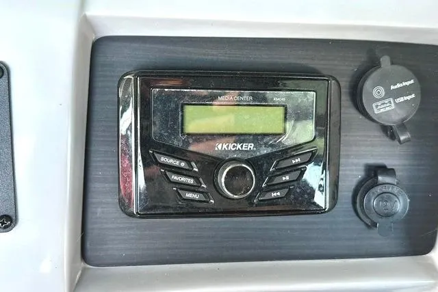 Slide: The Image of Kicker media center on 2021 Bennington L Bowrider 25 Quad Bench dashboard. - 12