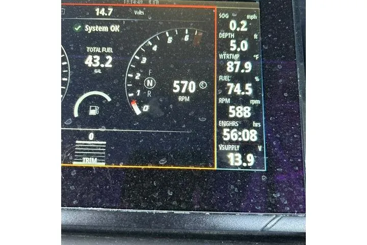Slide: The Image of Dashboard display of a 2021 Bennington L Bowrider 25 Quad Bench showing fuel, RPM, and system status. - 33