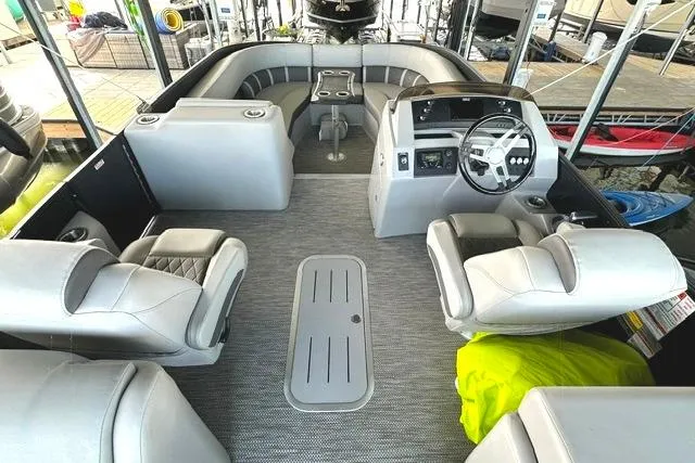 Slide: The Image of 2021 Bennington L Bowrider 25 Quad Bench interior with luxurious seating and modern helm. - 5