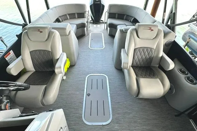 Slide: The Image of 2021 Bennington L Bowrider 25 Quad Bench interior with luxurious seating and modern design. - 7