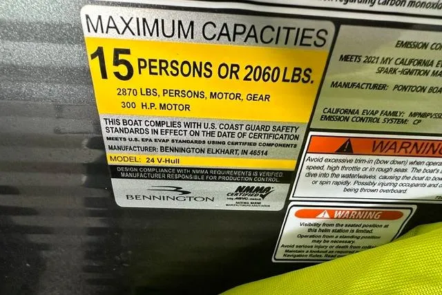 Slide: The Image of 2021 Bennington L Bowrider 25 Quad Bench capacity label, 15 persons or 2060 lbs, 300 HP motor. - 9