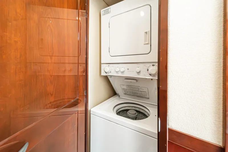 Slide: The Image of Stacked washer and dryer in 2008 Sea Ray 58 Sedan Bridge yacht interior. - 17