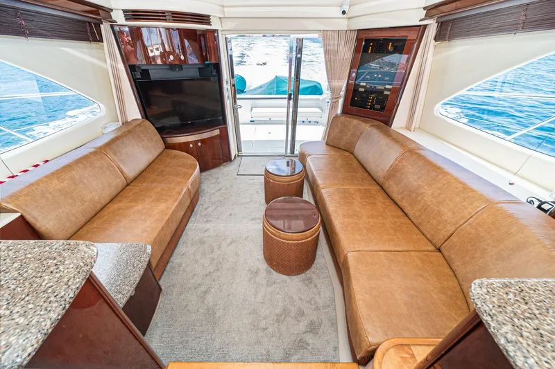 Slide: The Image of Luxurious interior of 2008 Sea Ray 58 Sedan Bridge yacht with leather seating and ocean view. - 7