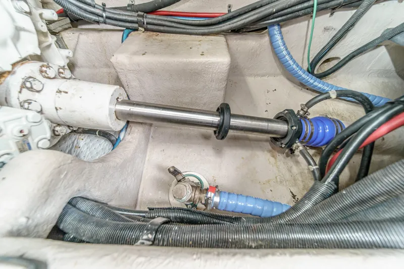 Slide: The Image of Engine compartment of 2008 Sea Ray 58 Sedan Bridge with visible shaft and wiring. - 23
