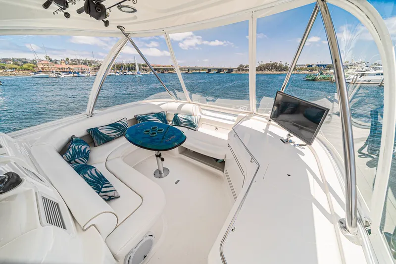 Slide: The Image of Luxurious 2008 Sea Ray 58 Sedan Bridge yacht interior with plush seating and scenic ocean view. - 6