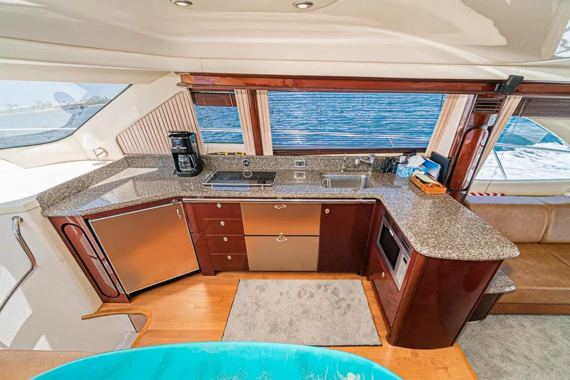 Slide: The Image of Luxurious kitchen interior of 2008 Sea Ray 58 Sedan Bridge yacht with ocean view. - 10
