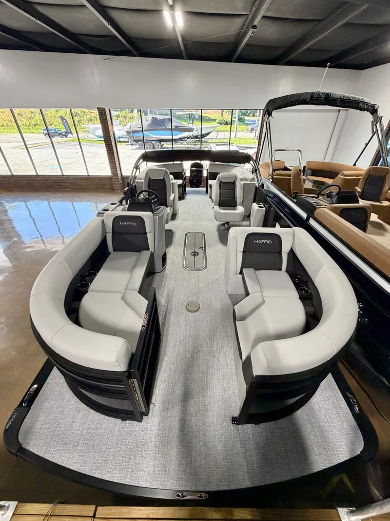 Slide: The Image of Interior view of a Harris Cruiser 210 Heritage pontoon boat with gray seating and modern design. - 13