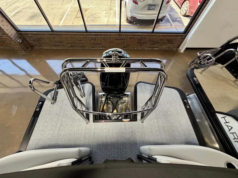 Slide: The Image of Interior view of a Harris Cruiser 210 Heritage with a modern helm and sleek seating. - 16