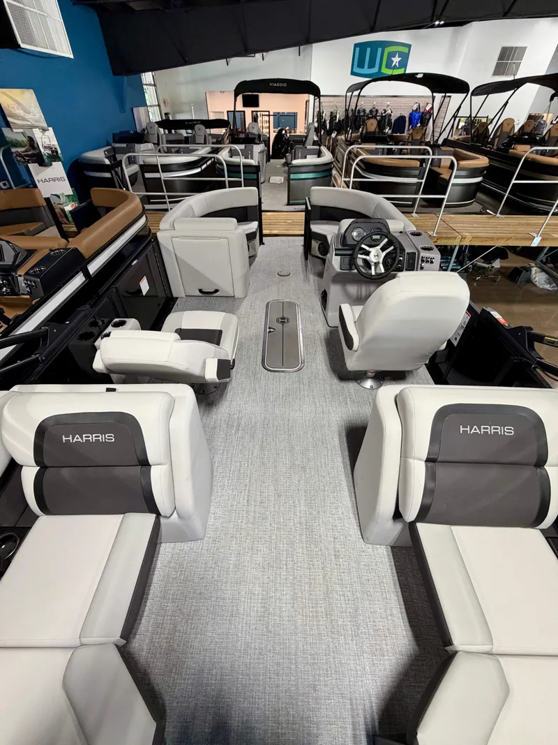 Slide: The Image of Interior view of a Harris Cruiser 210 Heritage with gray and black seating. - 5