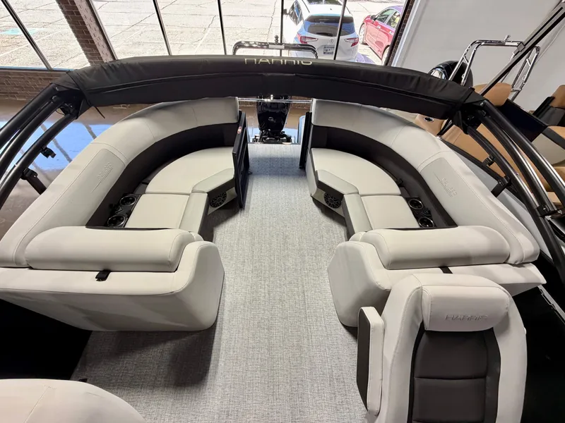 Slide: The Image of Interior of a Harris Cruiser 210 Heritage with gray upholstery and seating areas. - 6