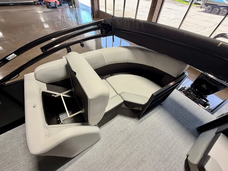 Slide: The Image of Interior of a Harris Cruiser 210 Heritage with gray upholstery and a foldable seat. - 7