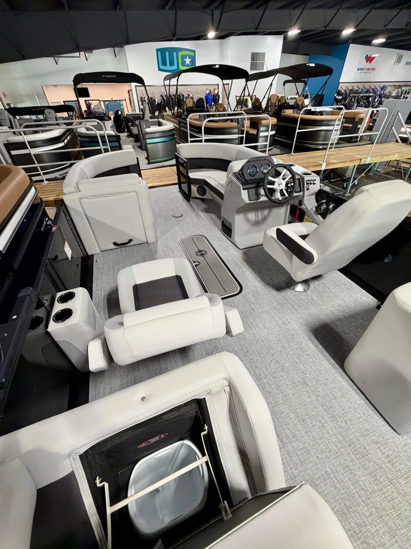 Slide: The Image of Interior of a modern pontoon boat with gray seating and a helm station. - 8