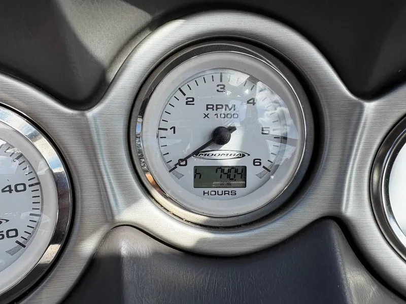 Slide: The Image of Close-up of a tachometer showing 704 engine hours. - 12