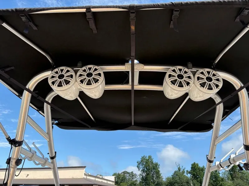 Slide: The Image of View of a 2006 Moomba Mobius LSV's black Bimini top with speakers. - 3