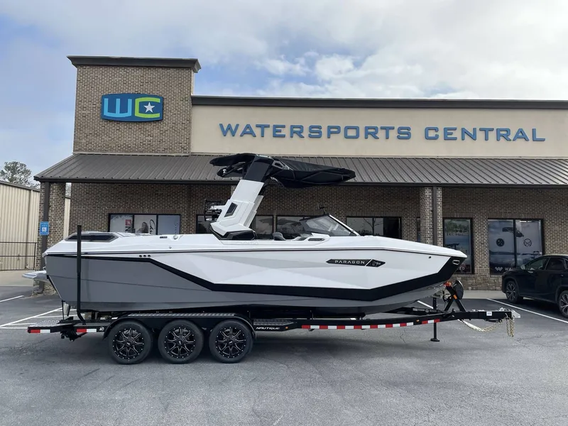 The Image of A 2026 Super Air Nautique G25 Paragon on a trailer in front of a watersports center. - 1