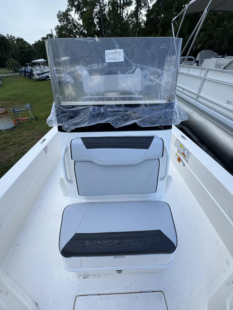Slide: The Image of The image shows the cockpit of a Skeeter SX Series SX241 boat with seating and a helm console. - 18