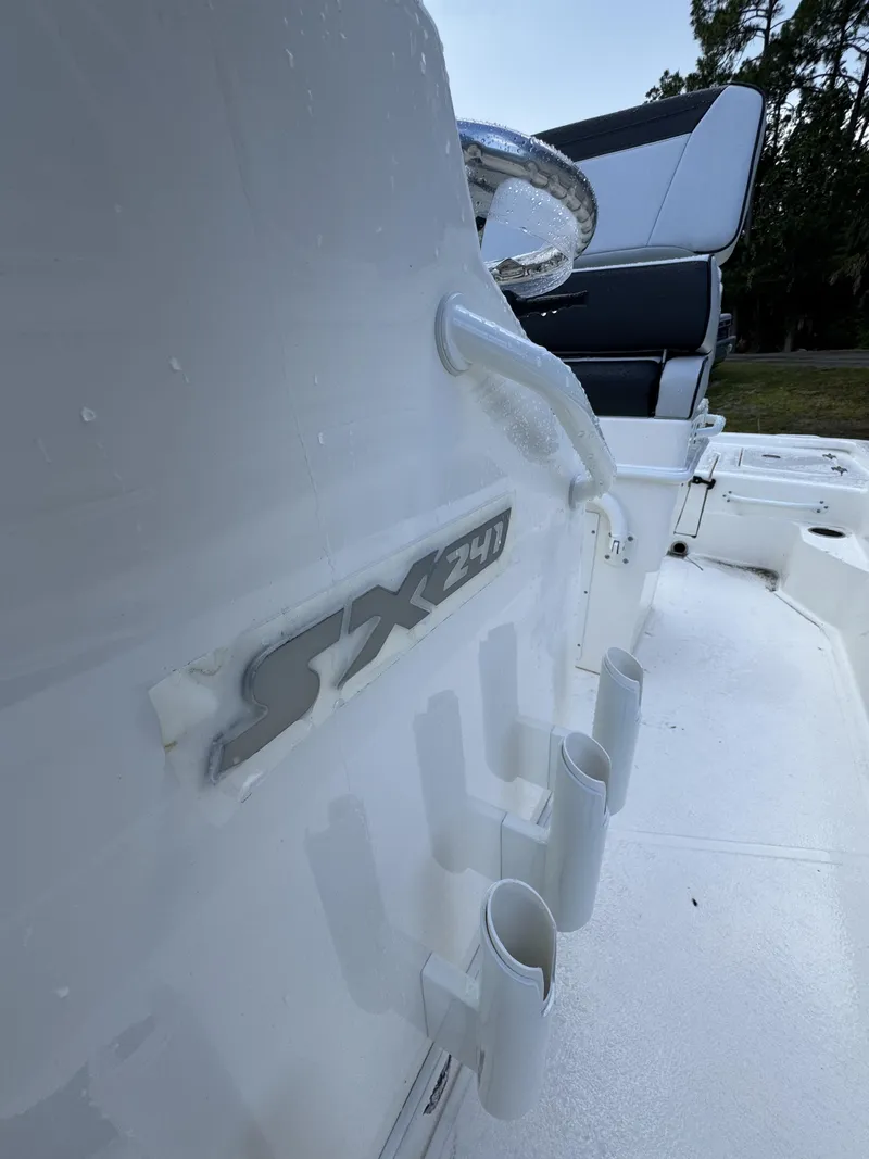 Slide: The Image of Close-up of a Skeeter SX Series SX241 boat interior with fishing rod holders. - 19