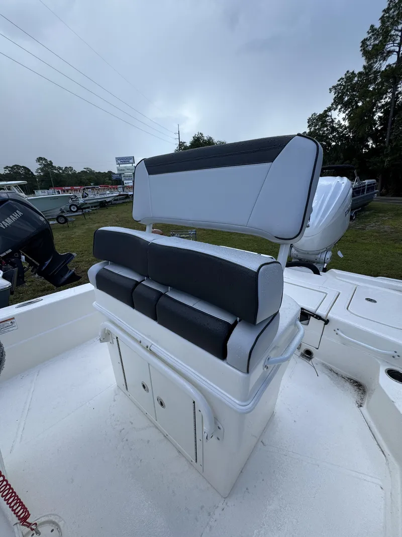 Slide: The Image of The image shows a white boat seat with black cushioning on a Skeeter SX Series SX241 boat. - 21