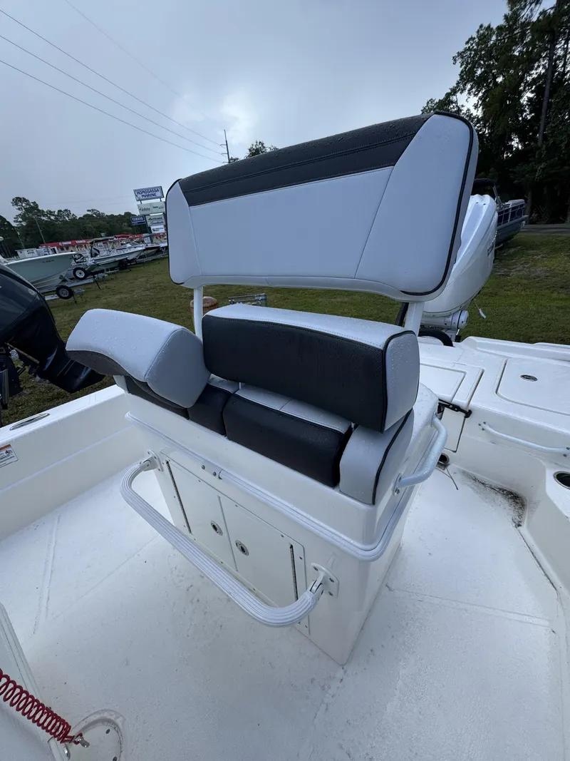 Slide: The Image of The image shows a white boat seat with black upholstery on a Skeeter SX Series SX241 boat. - 25