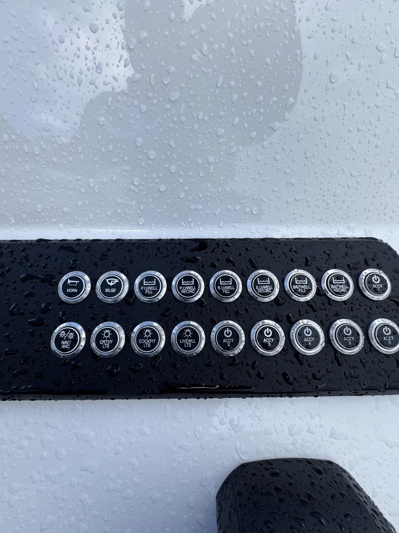Slide: The Image of Close-up of a control panel with multiple buttons on a boat. - 32