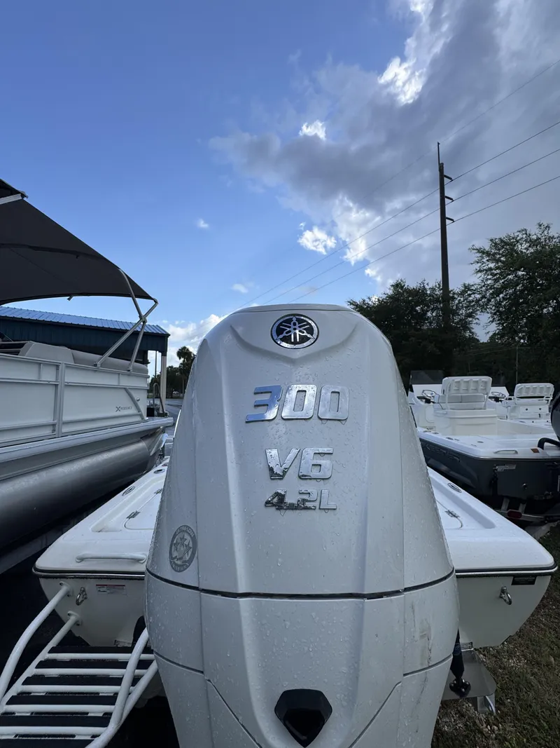 Slide: The Image of A boat with a 300 HP V6 4.2L outboard motor, surrounded by other boats. - 5