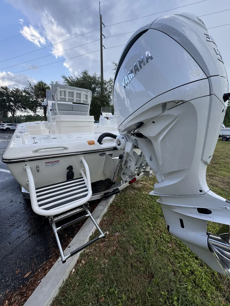 Slide: The Image of The image shows a Skeeter SX Series SX241 boat with a Yamaha outboard motor. - 8