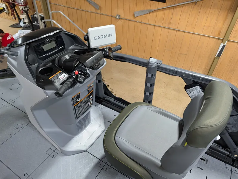 Slide: The Image of The image shows the cockpit of a 2026 Sea-Doo Switch Fish Compact with a Garmin device. - 4