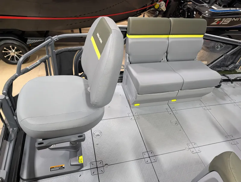Slide: The Image of Interior of a 2026 Sea-Doo Switch Fish Compact with gray seating and textured flooring. - 5